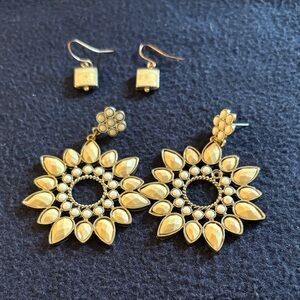 2 earrings. One square shape & one Sunburst Drop style.